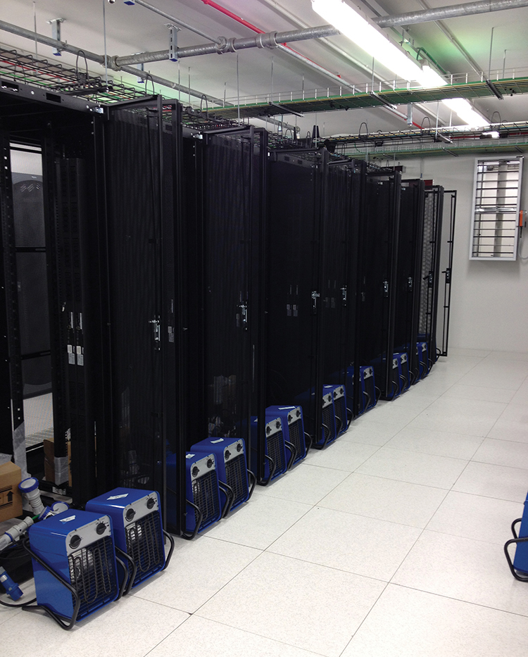 Figure 18-19. Two views of the data center floor, including heaters, during final testing. 